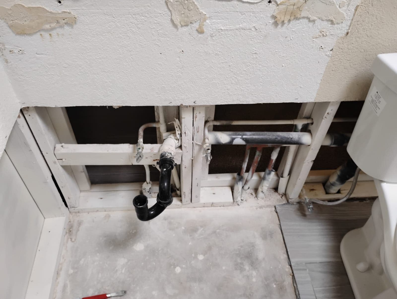 Bathroom Transformation in Progress Exposed Pipes to Elegant Vanity